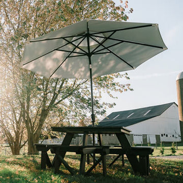 Park collection picnic table with umbrella on farm