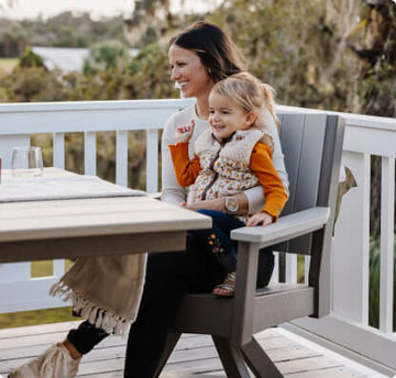 Woman holding child sitting in the chat chair